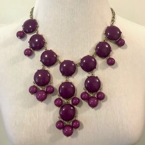 Chunky purple necklace.